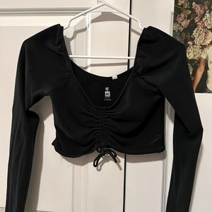 Black long-sleeve crop top.